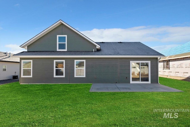 rear view of property with a patio area and a lawn