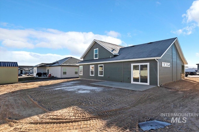 back of house with a patio area