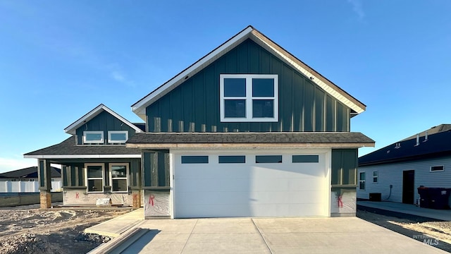 view of front of home featuring a garage and covered porch