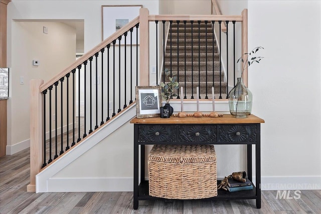 stairway featuring hardwood / wood-style flooring