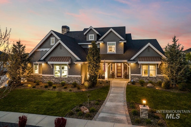 craftsman inspired home with a yard