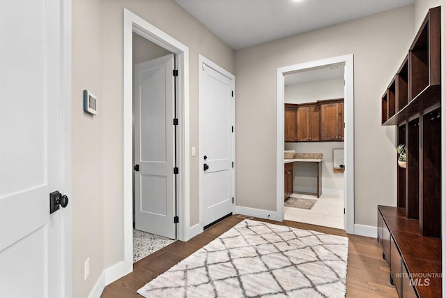 mudroom featuring dark wood-type flooring