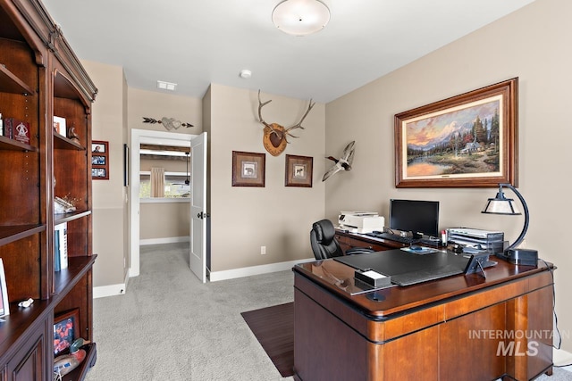office area featuring light colored carpet