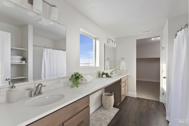 bathroom with hardwood / wood-style flooring and vanity