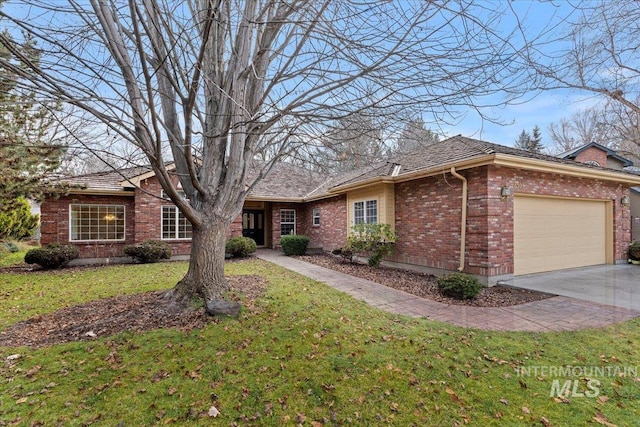 single story home with a front lawn and a garage