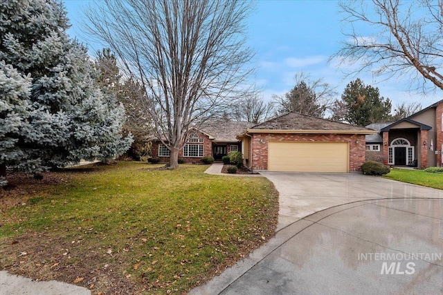 ranch-style home with a front yard and a garage