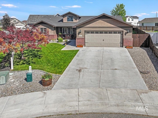614 Ethan Ct, Jerome, ID 83338 - view of front of property featuring brick siding, an attached garage, and concrete driveway