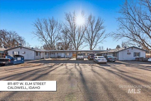 ranch-style home with a carport