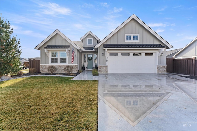 craftsman house with a garage and a front lawn