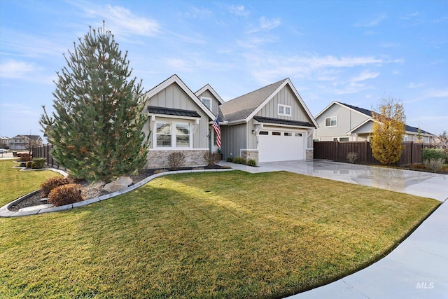 view of front of house with a garage and a front yard