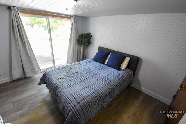 708 16th St, Clarkston, WA 99403 - bedroom with wood finished floors and access to exterior