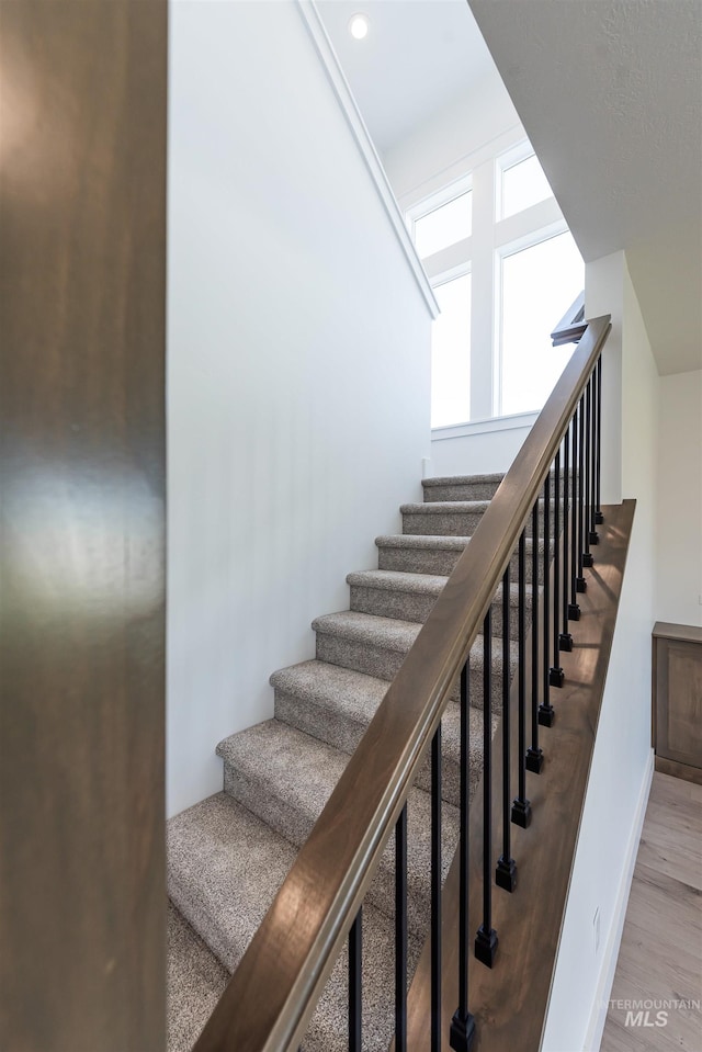 1246 E Rio Chico Dr, Kuna, ID 83634 - stairway featuring wood finished floors and baseboards