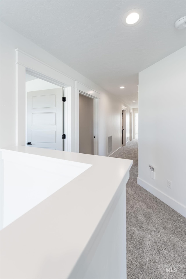 1246 E Rio Chico Dr, Kuna, ID 83634 - corridor with carpet flooring, recessed lighting, and baseboards