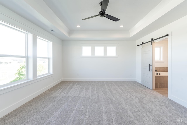 1246 E Rio Chico Dr, Kuna, ID 83634 - unfurnished room featuring healthy amount of natural light, light colored carpet, a barn door, baseboards, and recessed lighting