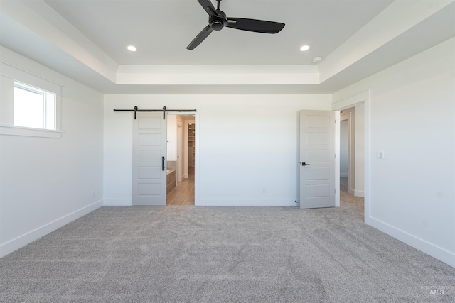 1246 E Rio Chico Dr, Kuna, ID 83634 - unfurnished bedroom featuring light carpet, a raised ceiling, baseboards, and recessed lighting