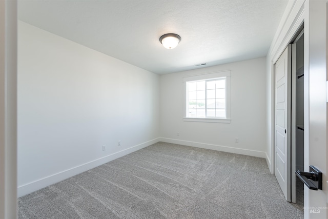 1246 E Rio Chico Dr, Kuna, ID 83634 - unfurnished bedroom featuring baseboards, carpet flooring, and a closet