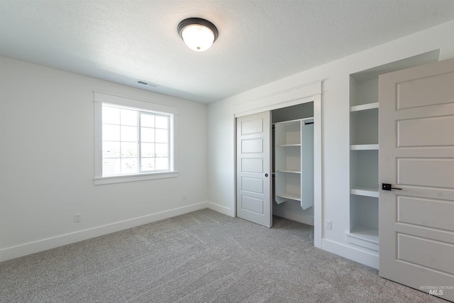 1246 E Rio Chico Dr, Kuna, ID 83634 - unfurnished bedroom with carpet flooring, a closet, and baseboards