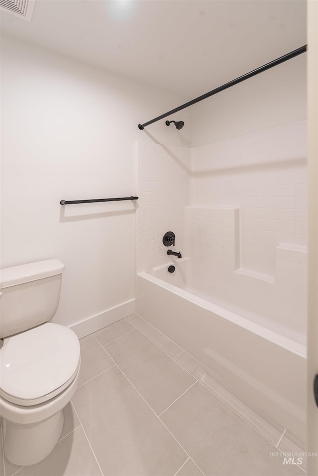 1246 E Rio Chico Dr, Kuna, ID 83634 - bathroom featuring toilet, washtub / shower combination, tile patterned floors, and baseboards
