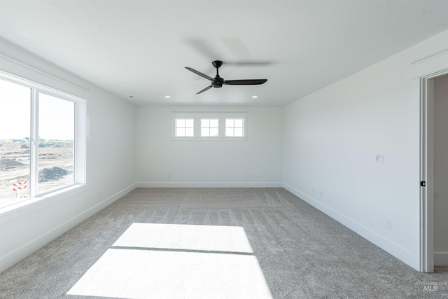 1246 E Rio Chico Dr, Kuna, ID 83634 - empty room with light carpet, a ceiling fan, baseboards, and recessed lighting
