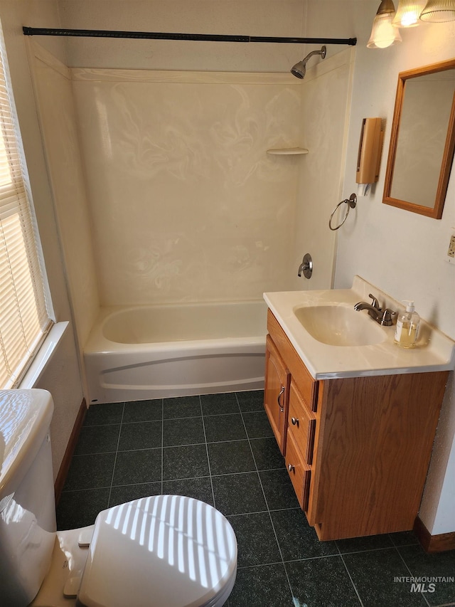 full bathroom featuring vanity, toilet, washtub / shower combination, and tile patterned flooring