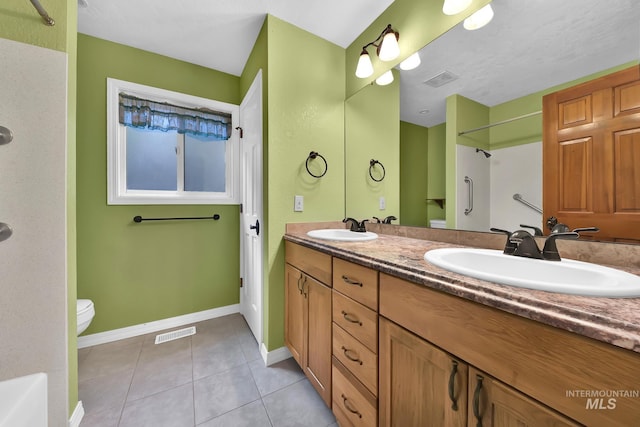 204 Hilldrop St, Caldwell, ID 83605 - full bath with tile patterned floors, visible vents, a sink, and a shower