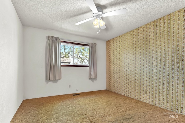 204 Hilldrop St, Caldwell, ID 83605 - unfurnished room with visible vents, carpet flooring, a textured ceiling, and ceiling fan