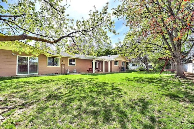 204 Hilldrop St, Caldwell, ID 83605 - rear view of house with fence and a yard