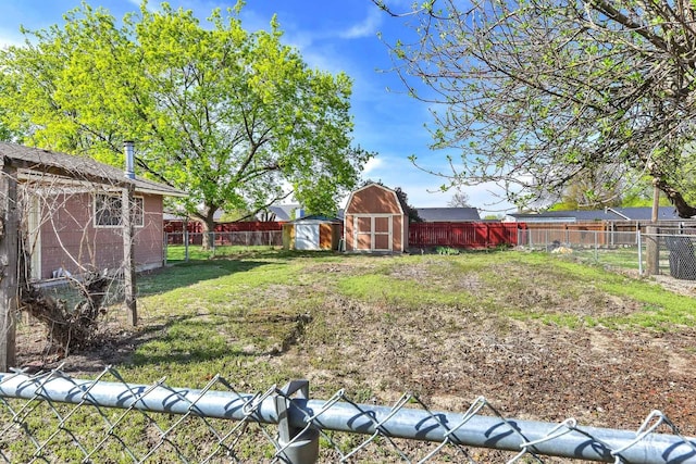 204 Hilldrop St, Caldwell, ID 83605 - view of yard with an outbuilding, a shed, and a fenced backyard