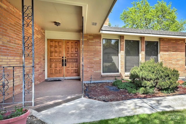 204 Hilldrop St, Caldwell, ID 83605 - property entrance with brick siding and visible vents