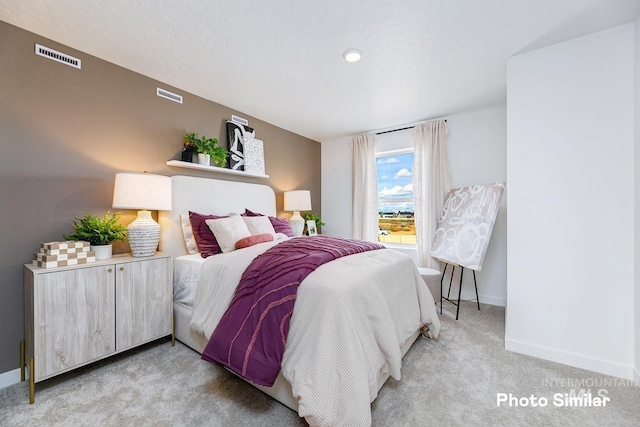 carpeted bedroom with baseboards