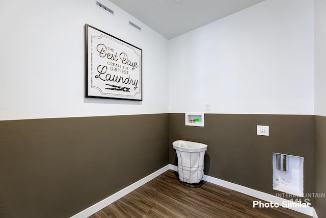 laundry area featuring hookup for a washing machine, hookup for an electric dryer, dark wood-style flooring, and baseboards