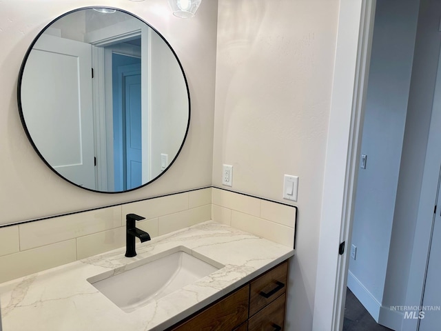 bathroom with backsplash and vanity