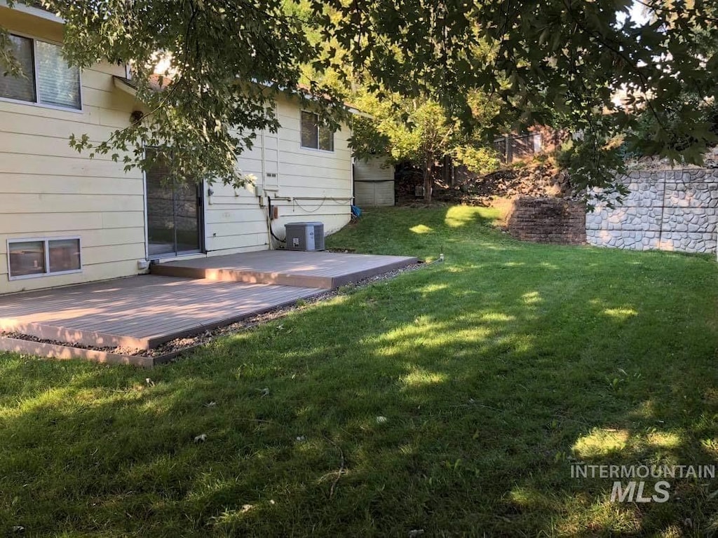 view of yard featuring fence and a patio