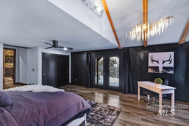 bedroom featuring ceiling fan, french doors, dark wood-type flooring, lofted ceiling with beams, and a textured ceiling