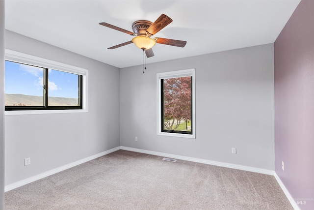 3224 Meadowlark, Lewiston, ID 83501 - carpeted spare room with healthy amount of natural light, ceiling fan, and baseboards