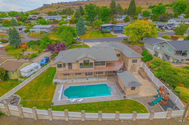 3224 Meadowlark, Lewiston, ID 83501 - aerial view of residential area featuring a pool and a mountainous background