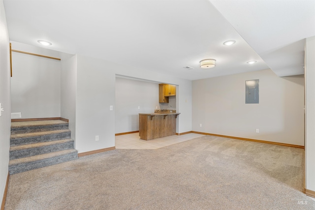 3224 Meadowlark, Lewiston, ID 83501 - unfurnished living room featuring electric panel, light colored carpet, recessed lighting, baseboards, and stairs
