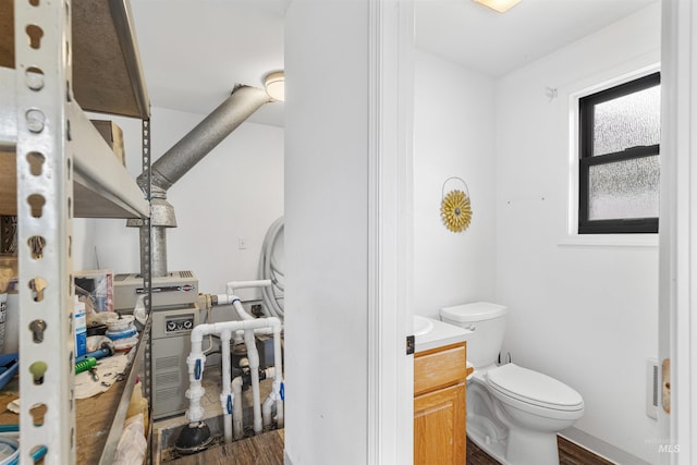 3224 Meadowlark, Lewiston, ID 83501 - bathroom with wood finished floors, toilet, and vanity