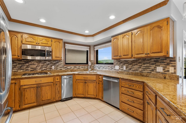 3224 Meadowlark, Lewiston, ID 83501 - kitchen featuring appliances with stainless steel finishes, a sink, ornamental molding, brown cabinetry, and recessed lighting