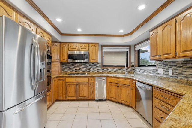 3224 Meadowlark, Lewiston, ID 83501 - kitchen with appliances with stainless steel finishes, a sink, ornamental molding, decorative backsplash, and brown cabinets