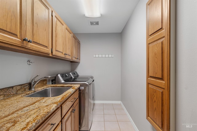 3224 Meadowlark, Lewiston, ID 83501 - washroom with washing machine and clothes dryer, cabinet space, light tile patterned floors, and baseboards