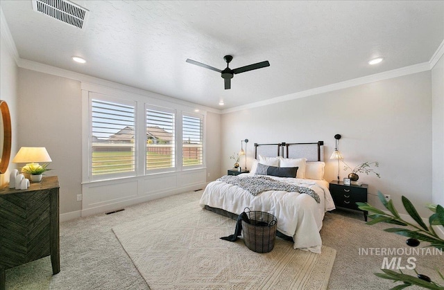 bedroom with carpet floors, recessed lighting, and visible vents