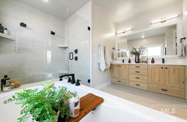 bathroom featuring double vanity, a tub, tile patterned floors, and a shower stall
