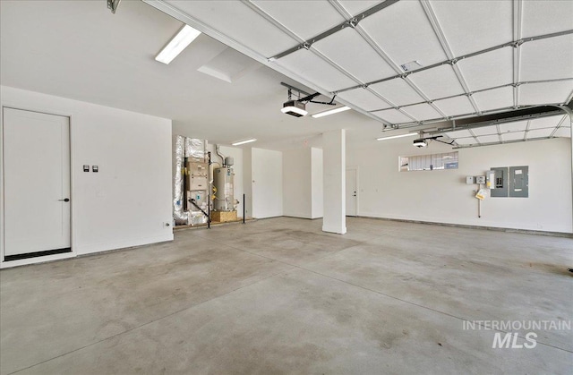 garage featuring water heater and a garage door opener