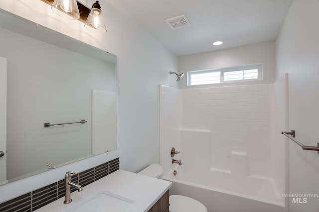 bathroom featuring recessed lighting, toilet, visible vents, vanity, and washtub / shower combination
