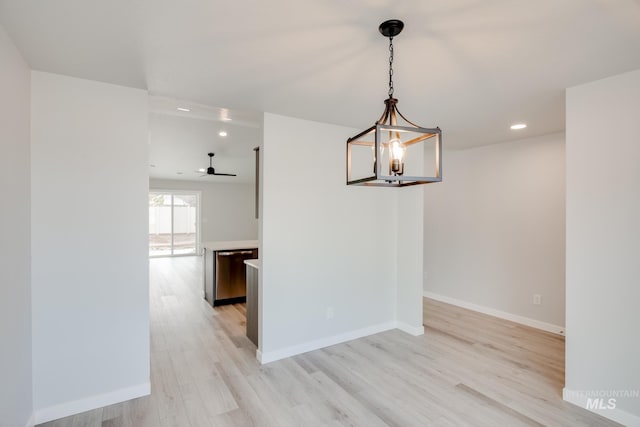 unfurnished dining area featuring ceiling fan and light hardwood / wood-style flooring