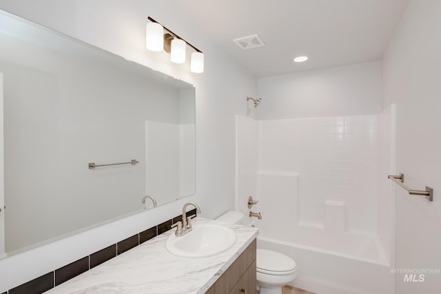 full bathroom featuring vanity, toilet, and bathing tub / shower combination