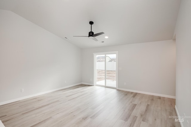 unfurnished room with vaulted ceiling, ceiling fan, and light wood-type flooring