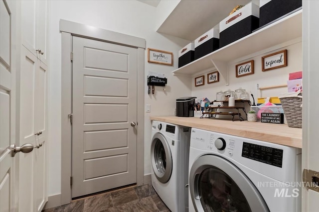 laundry area featuring laundry area and washer and clothes dryer