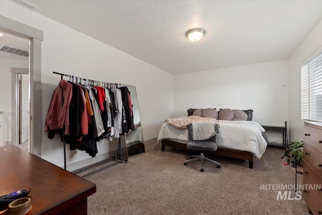 carpeted bedroom with visible vents